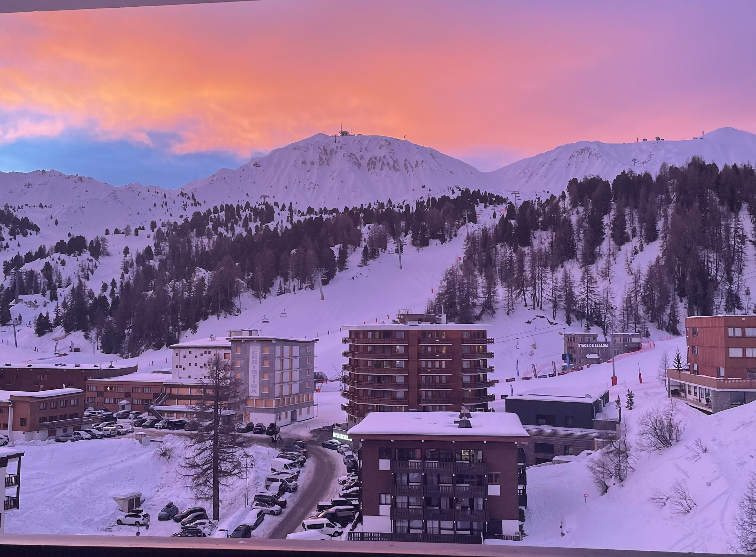 Sunset over snowy Plagne Centre and the surrounding peaks