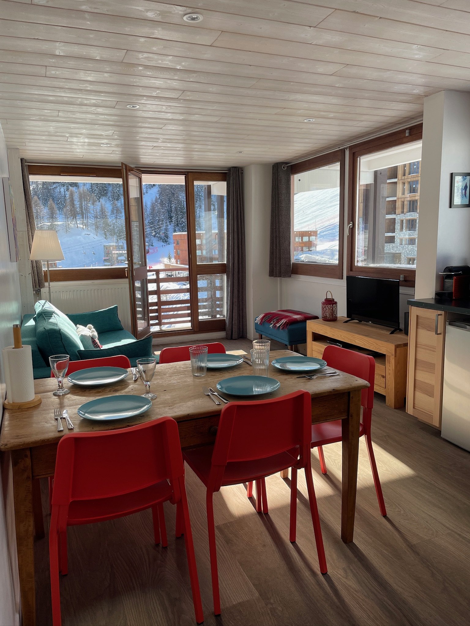 Dining table looking through to the balcony and snowy Plagne Centre