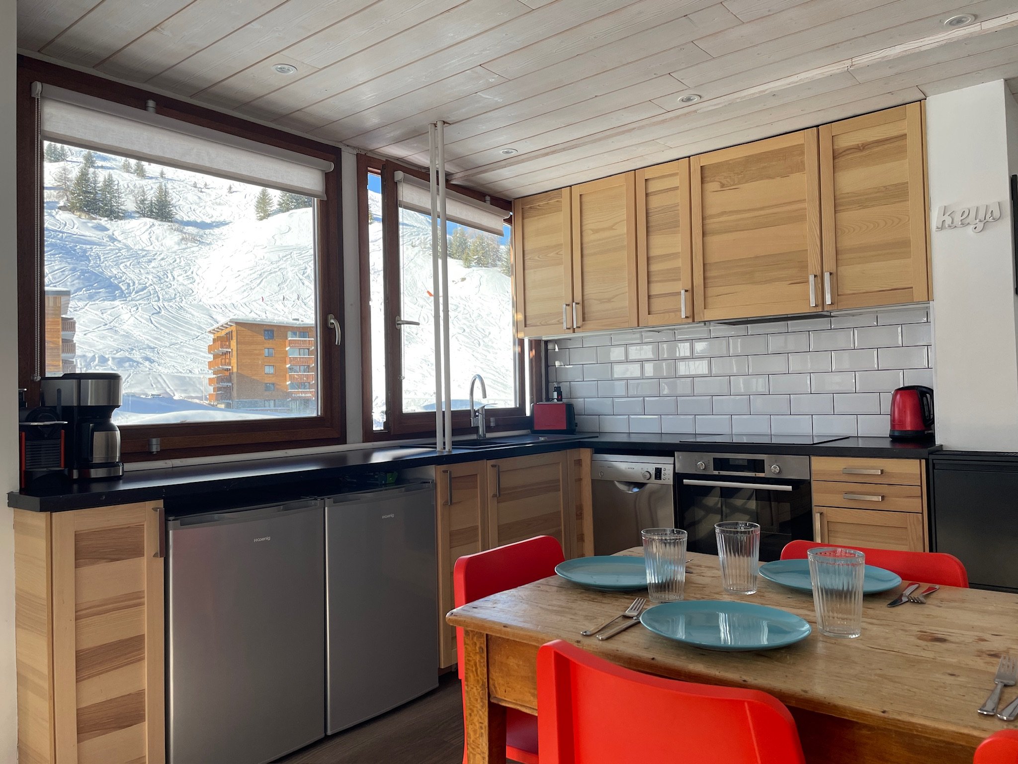 Kitchen at SnowBadgers with windows onto the pistes
